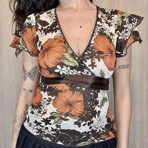 Floral top with ribbon tie and ruffle sleeves